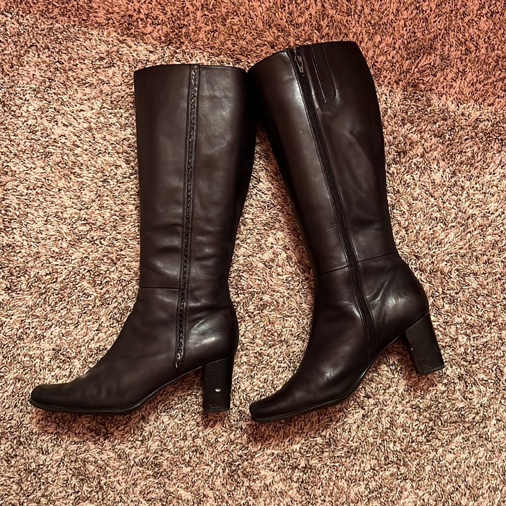 Knee high black heeled boots